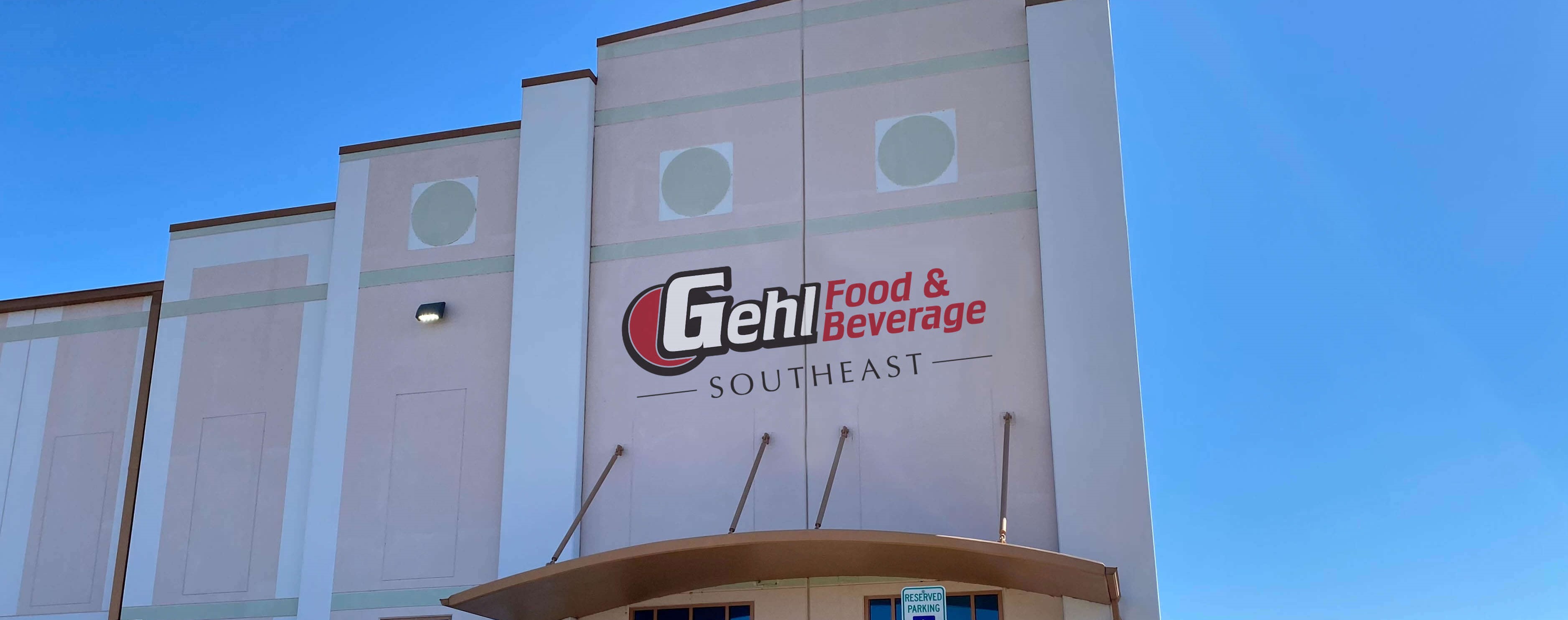 Large White Industry Building with Gehl Food & Beverage Southeast Logo on front.